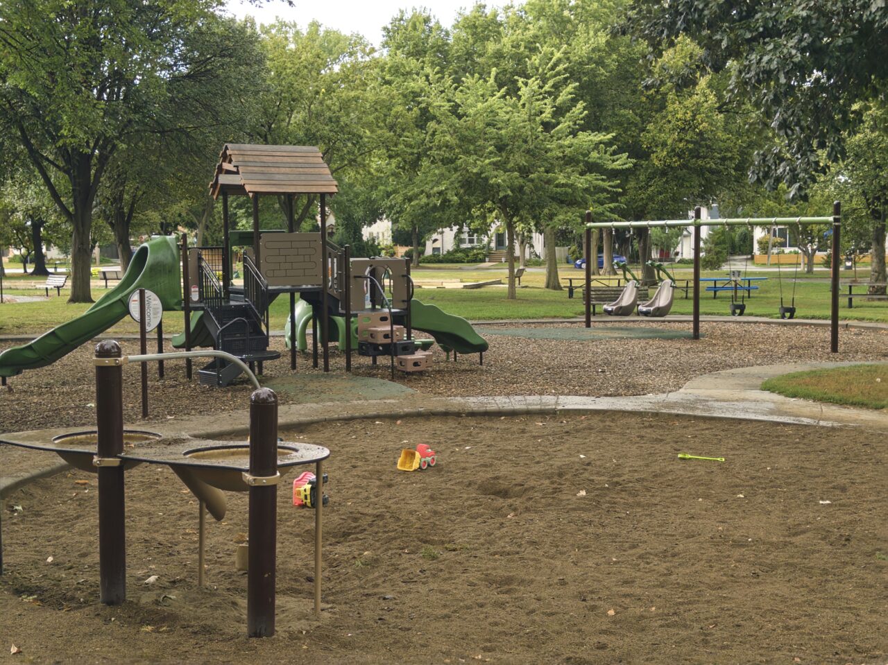 Linden Hills playground, with sand pit in foreground.